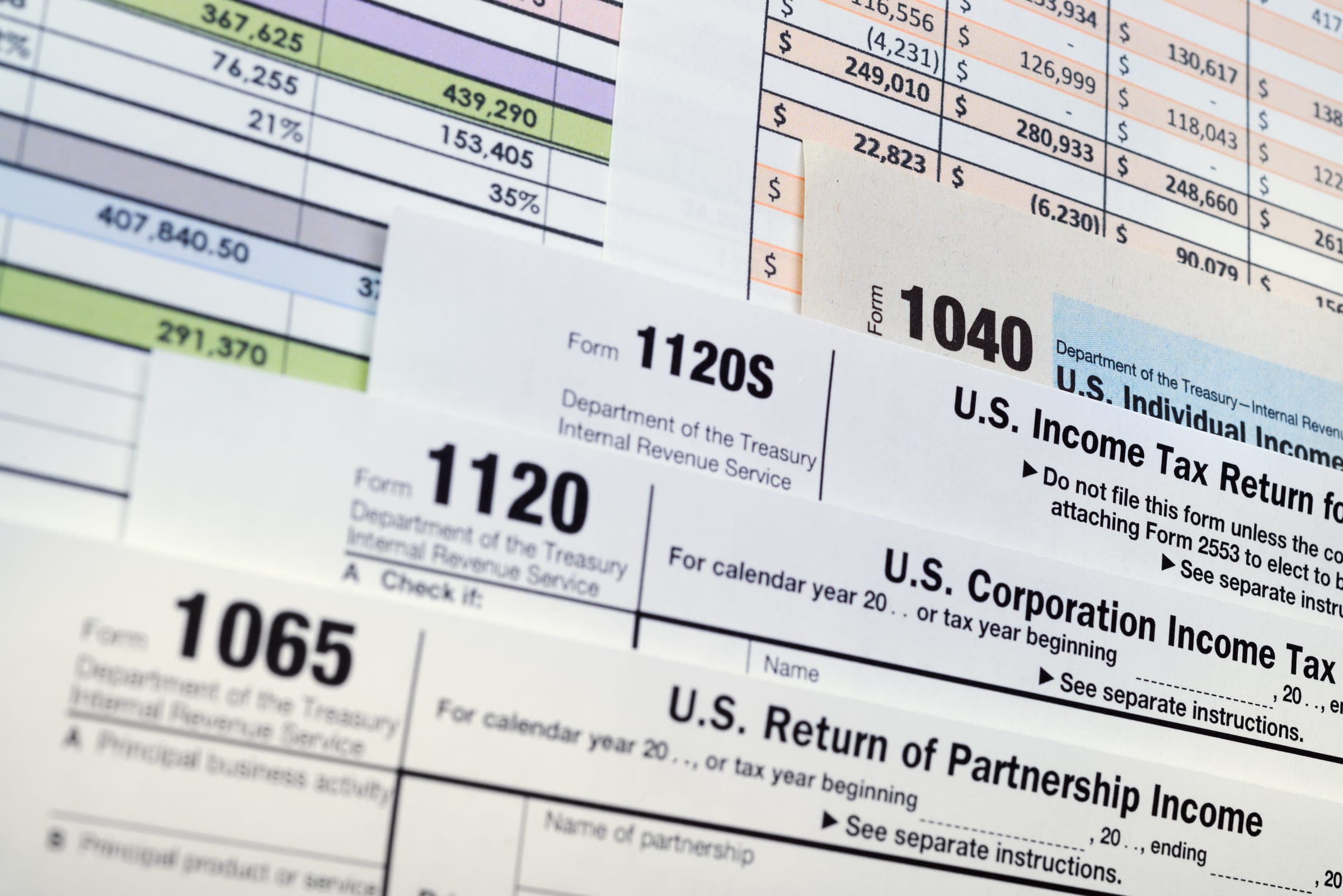 Tax forms including Forms 1040, 1065, 1120, and 1120-S